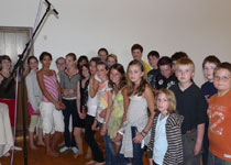 The kids rehearsing the lyrics